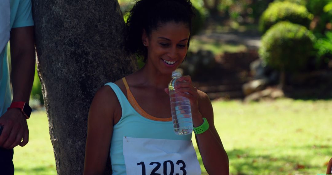 Female Runner Resting After Marathon Drinking Water - Free Images, Stock Photos and Pictures on Pikwizard.com