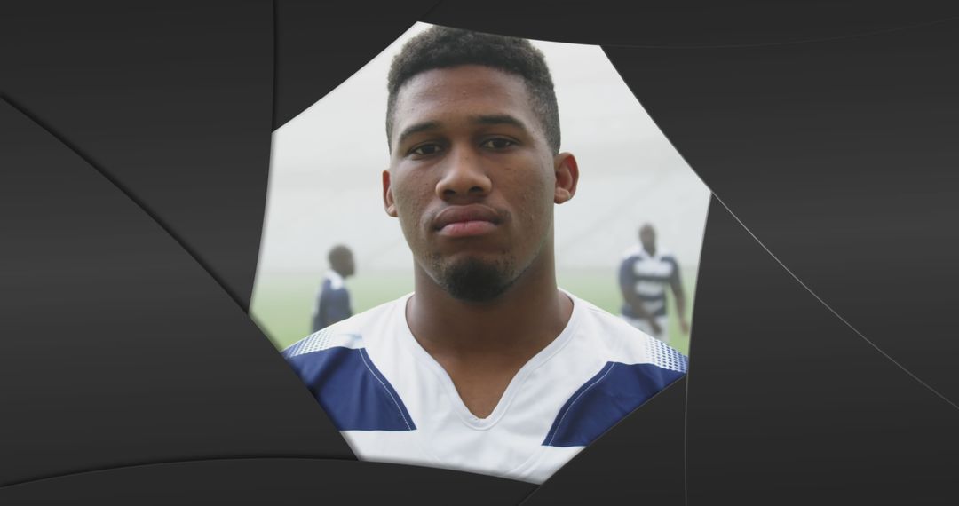 Focused Rugby Player Portrait Amid Abstract Black Shapes
