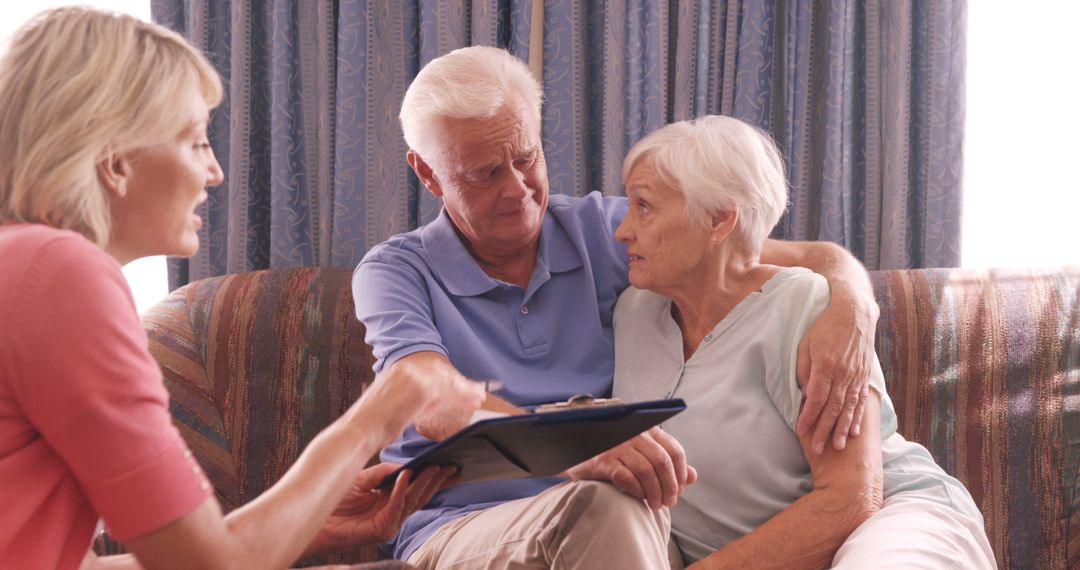 Senior Couple Receiving Guidance from Consultant on Couch - Free Images, Stock Photos and Pictures on Pikwizard.com