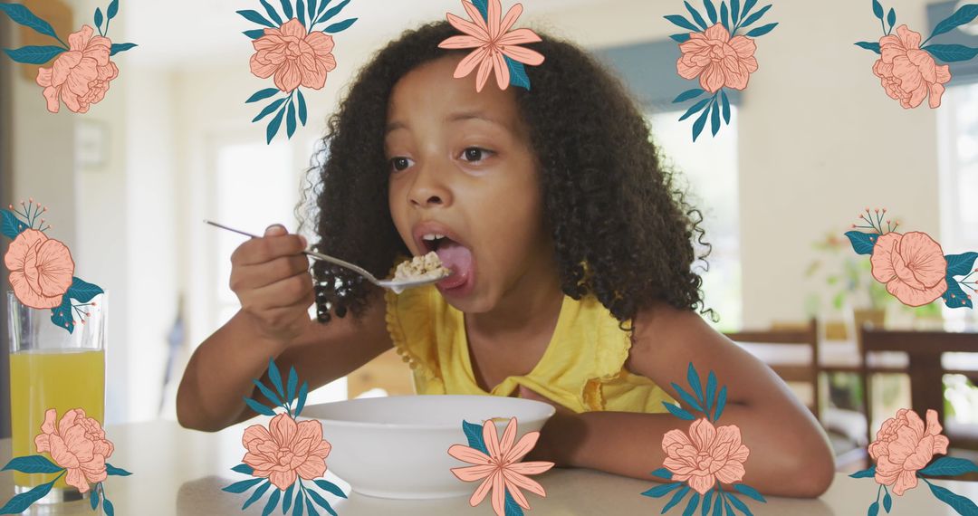 African American Girl Enjoying Breakfast at Home Surrounded by Floral Designs