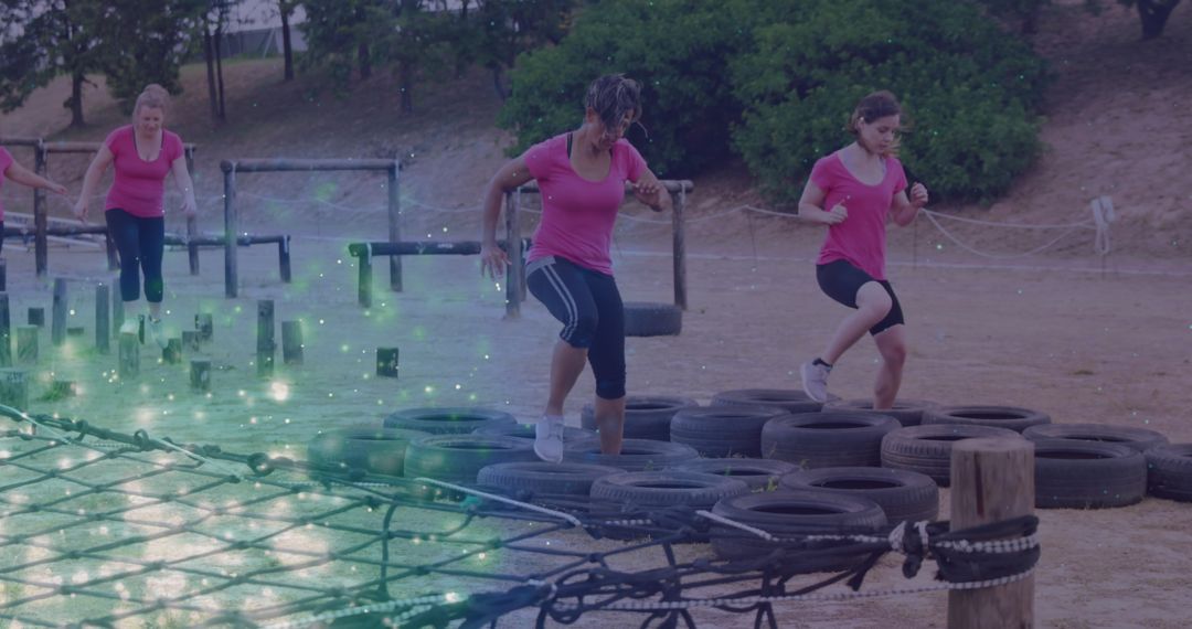Women Conquering Outdoor Obstacle Course in Team Sprint