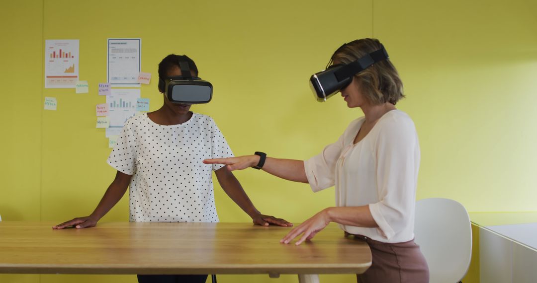 Diverse Female Colleagues Testing VR Goggles in Modern Office - Free Images, Stock Photos and Pictures on Pikwizard.com