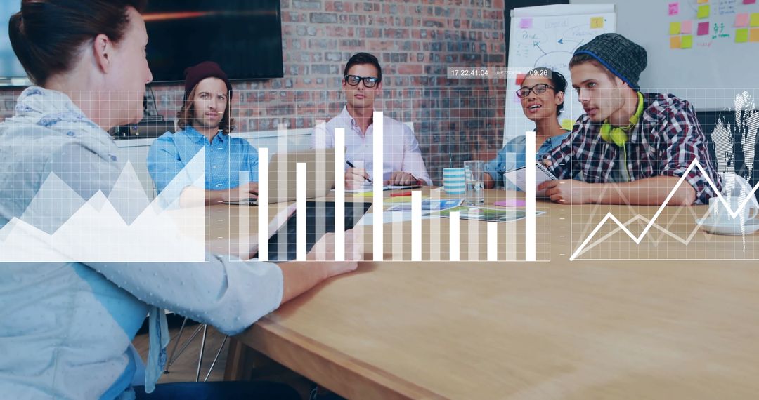 Diverse Team discusses Financial Data in Modern Office Environment