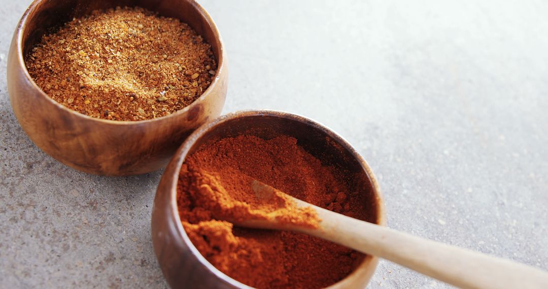 Two Wooden Bowls of Spices on a Gray Surface - Free Images, Stock Photos and Pictures on Pikwizard.com