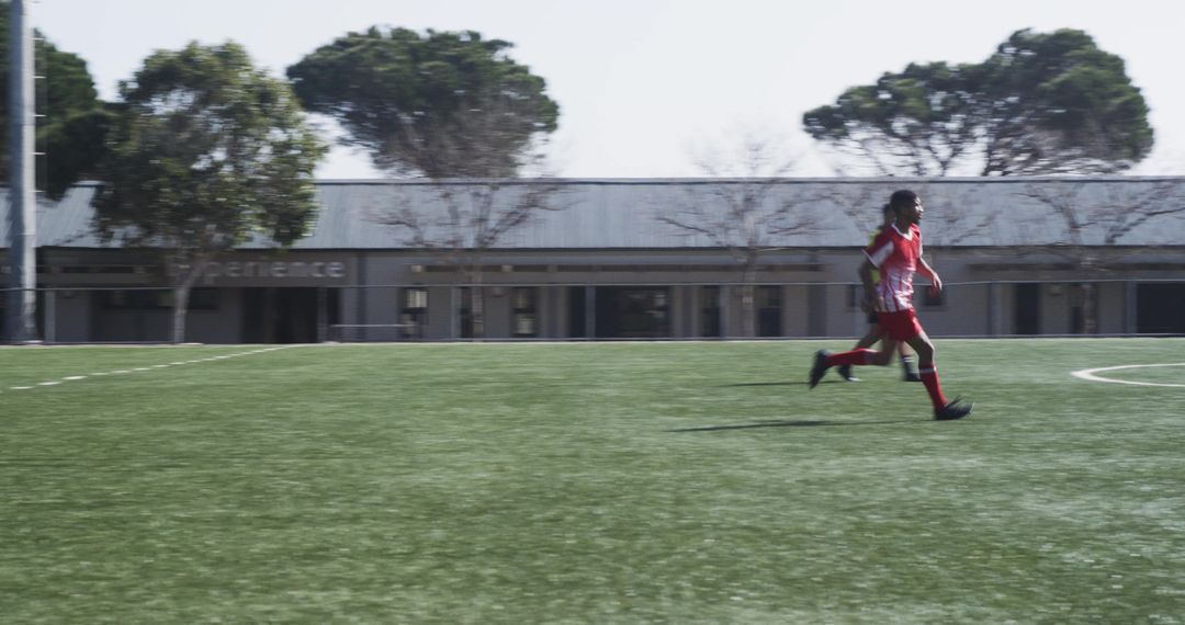 Focused Soccer Player Running During Training Session