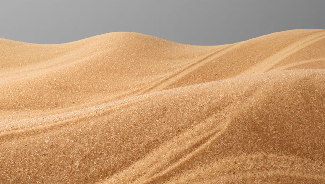 Undulating Sand Dunes Showing Smooth Ripples and Mineral Flecks Under Gray Sky
