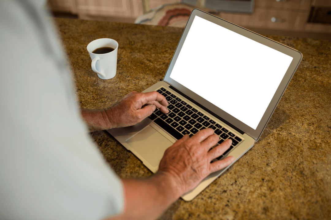 Senior Man Using Laptop in Modern Kitchen with Transparent Screen
