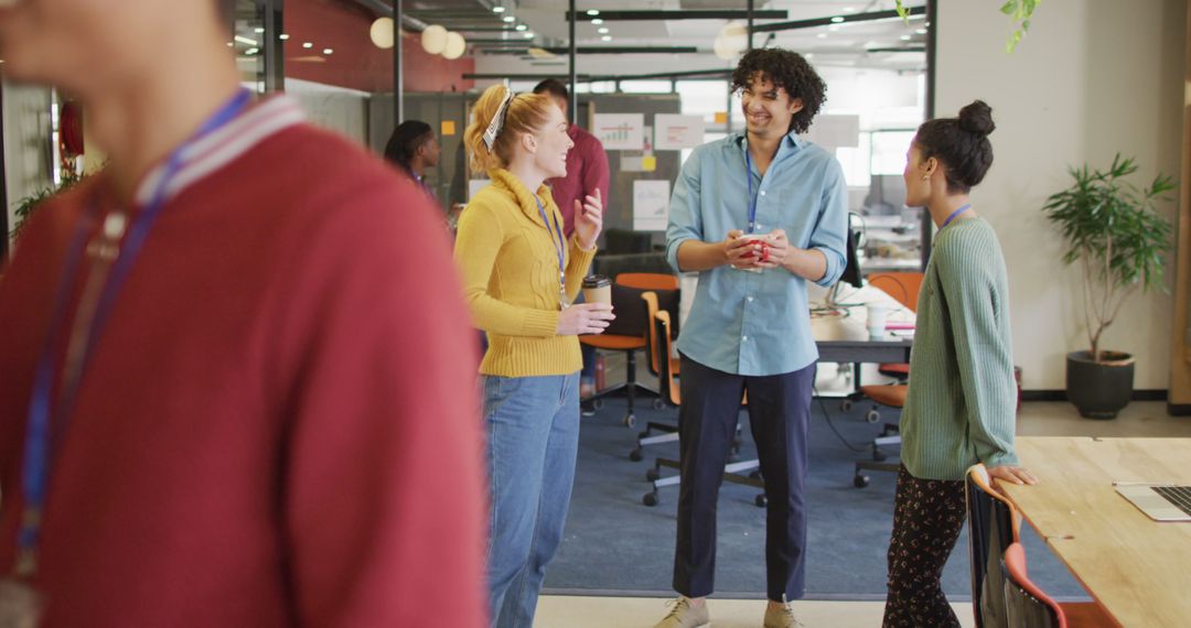 Happy Multiracial Team Collaborating in Modern Office Environment