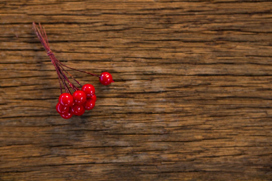Bunch of fake cherry on wooden plank - Free Images, Stock Photos and Pictures on Pikwizard.com