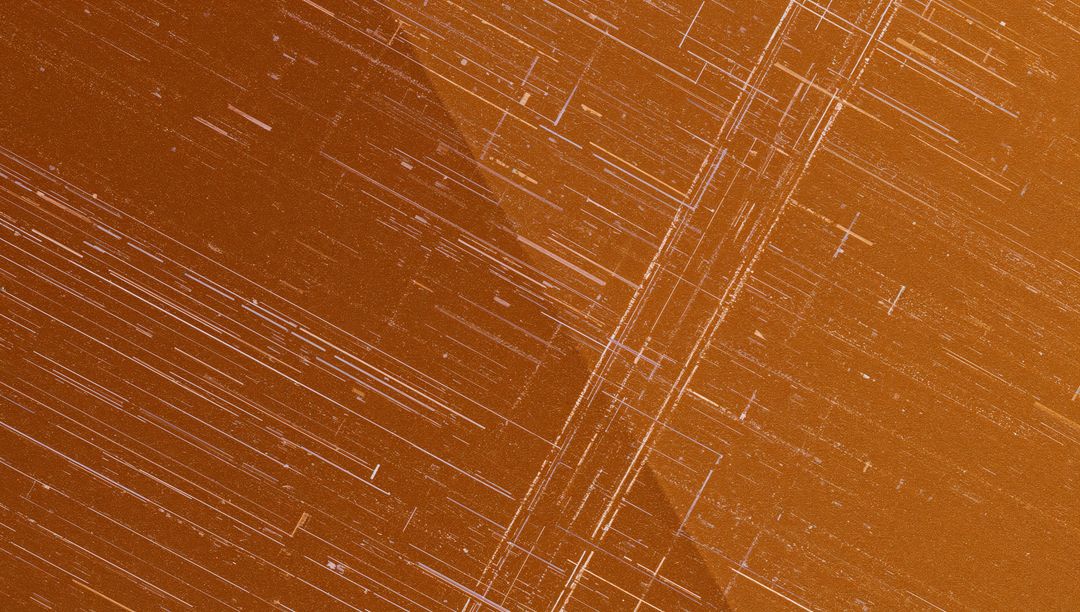 Abstract Etched Orange Metallic Surface with Linear Streaks