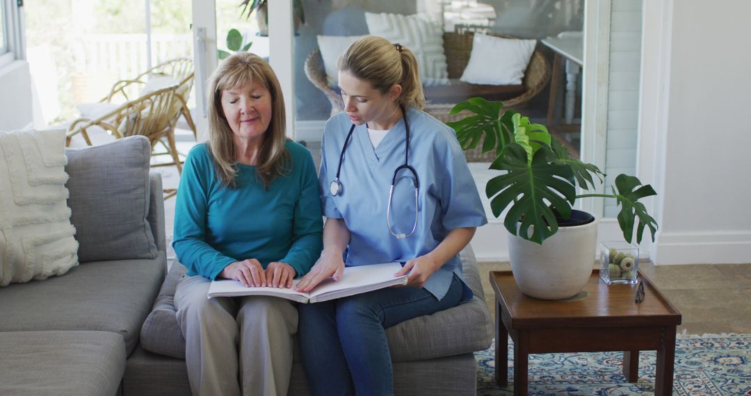 Elderly Woman Reading Braille with Nurse at Home - Free Images, Stock Photos and Pictures on Pikwizard.com