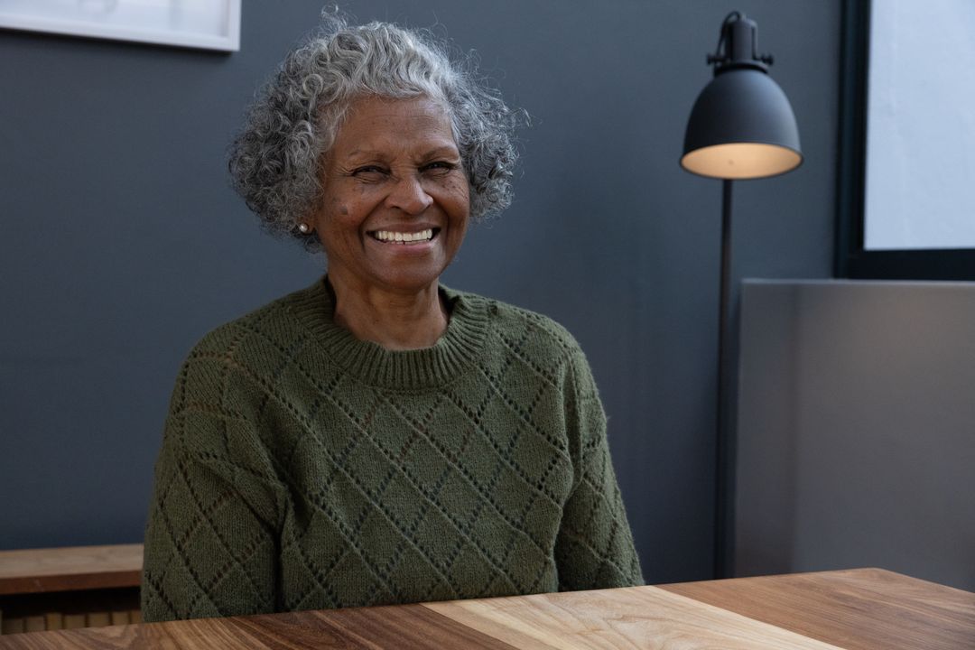 Senior Woman Smiling in Cozy Home Environment