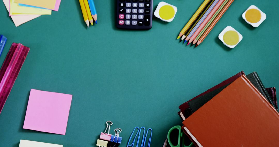 Colorful School Supplies Neatly Arranged on a Green Desk - Free Images, Stock Photos and Pictures on Pikwizard.com