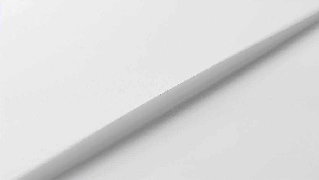 Diagonal Crease on White Paper Creating Soft Shadow Minimal Monochrome Abstract