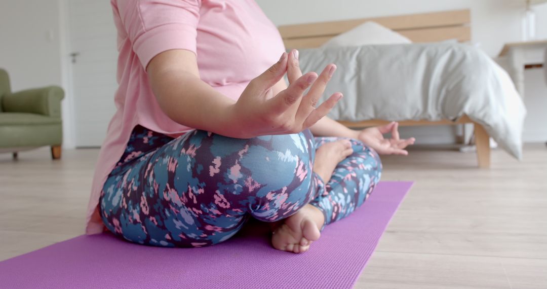 Relaxed Plus Size Woman Meditating in Tranquil Home Environment