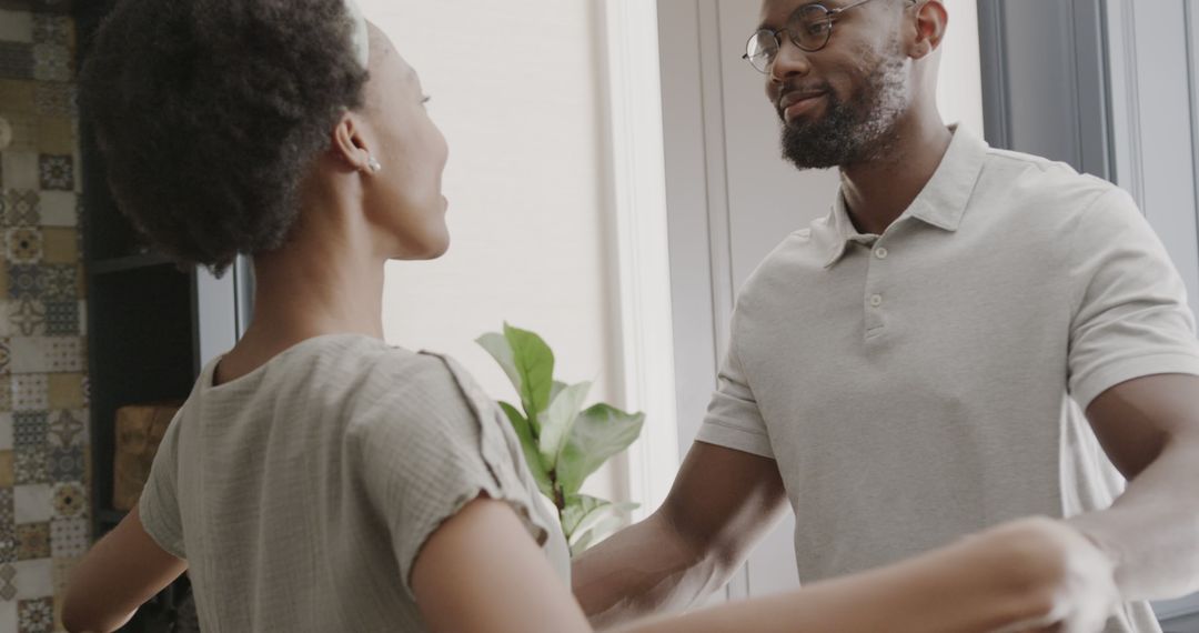 Joyful Elderly Couple Embracing in Modern Home Environment