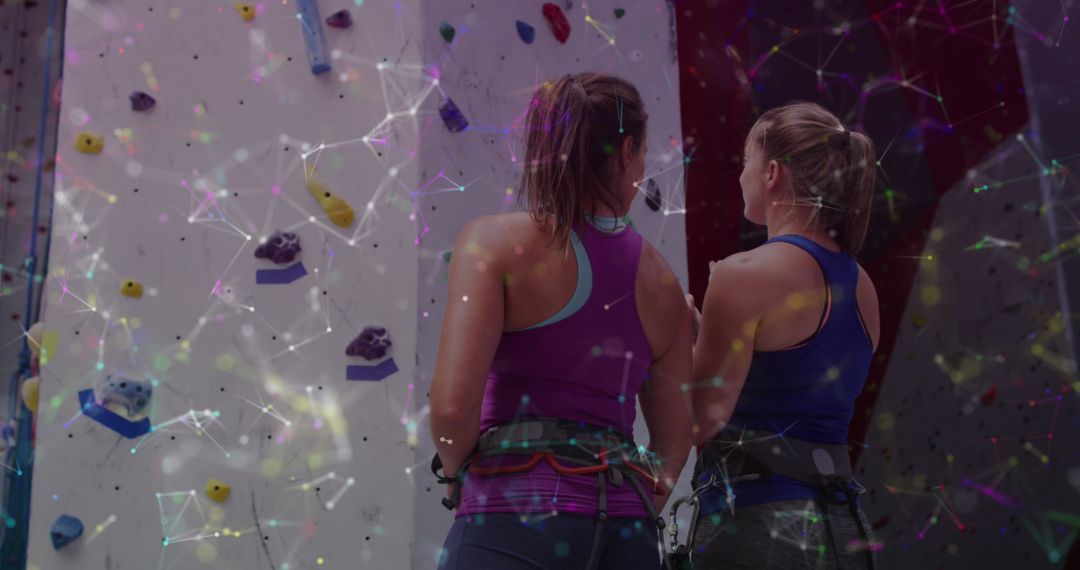 Women Rock Climbing with Digital Data Overlay