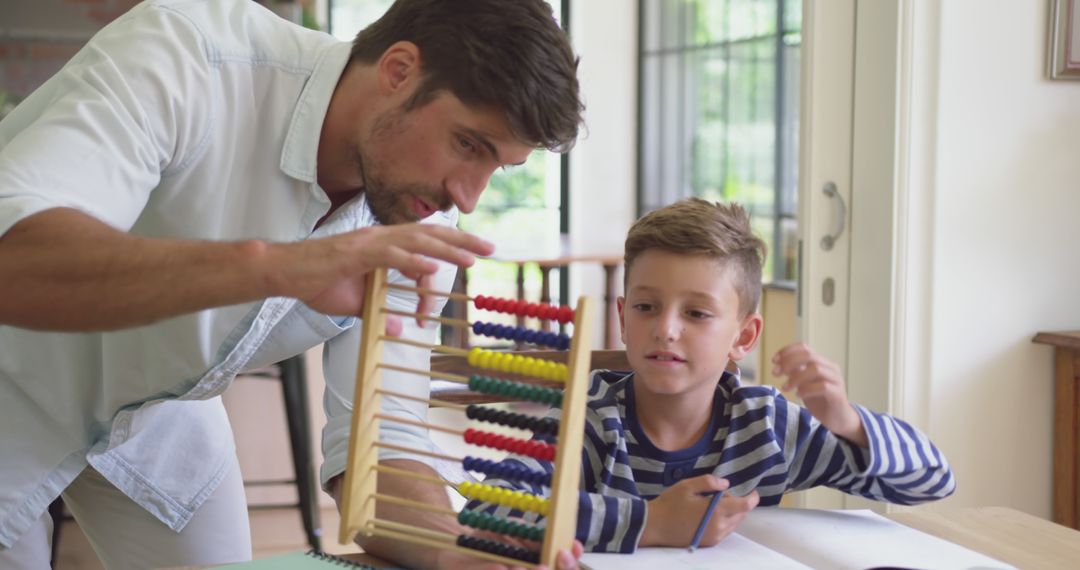 Father Using Abacus to Teach Son at Home - Free Images, Stock Photos and Pictures on Pikwizard.com