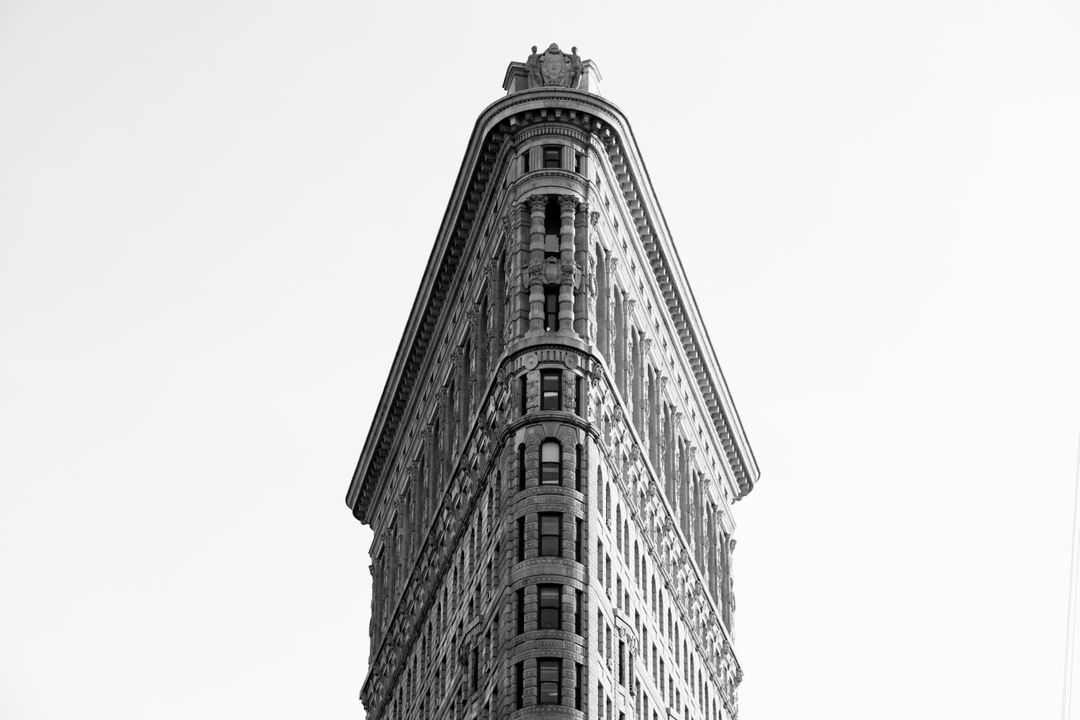 Black and White View of Historic Flatiron Building on Clear Day - Free Images, Stock Photos and Pictures on Pikwizard.com