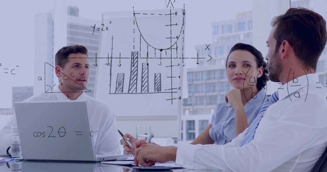 Business Team Analyzing Graphs at Conference Room