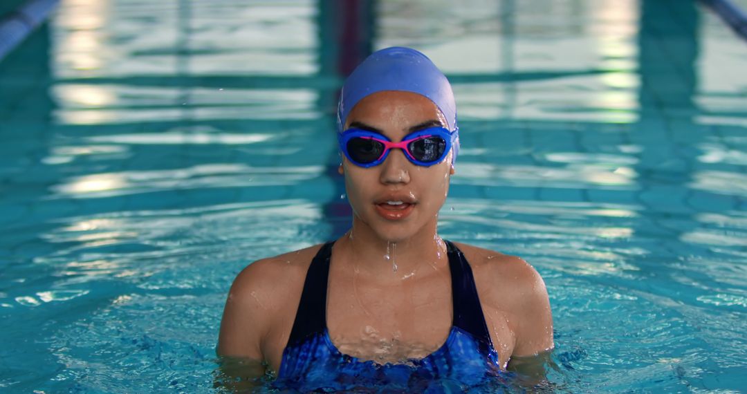 Young Female Swimmer in Pool Wearing Swim Cap and Goggles - Free Images, Stock Photos and Pictures on Pikwizard.com