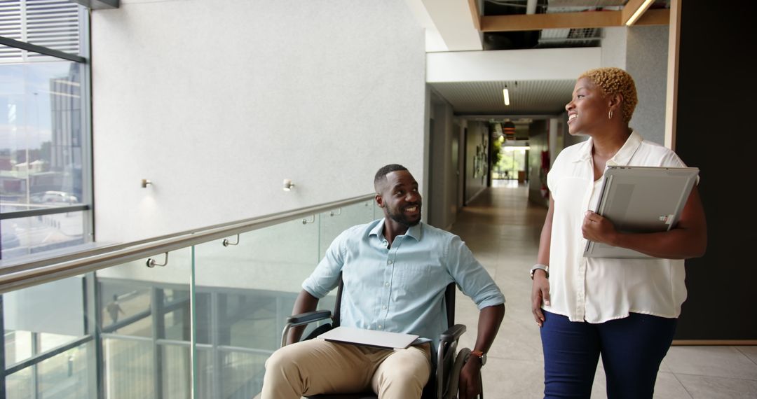 Inclusive Workplace: Colleagues Collaborating in Office Corridor