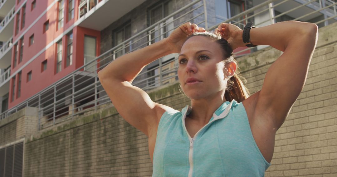 Determined Athlete Preparing for Outdoor Workout Before Urban Apartment Building - Free Images, Stock Photos and Pictures on Pikwizard.com