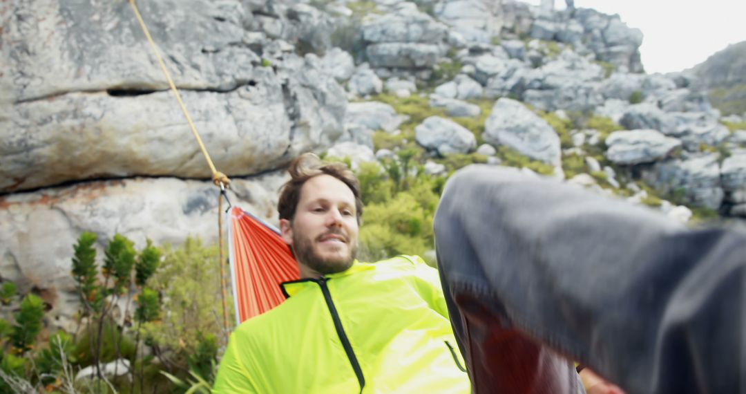 Man Relaxing in Bright Hammock in Scenic Mountain Landscape - Free Images, Stock Photos and Pictures on Pikwizard.com