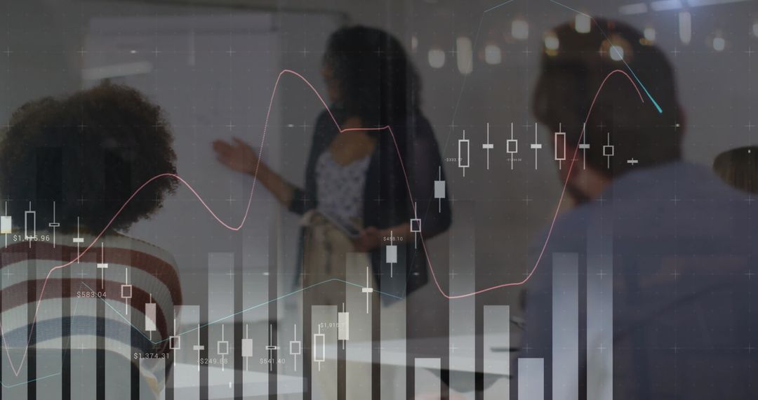 Colleagues Analyzing Data Trends in Modern Workspace