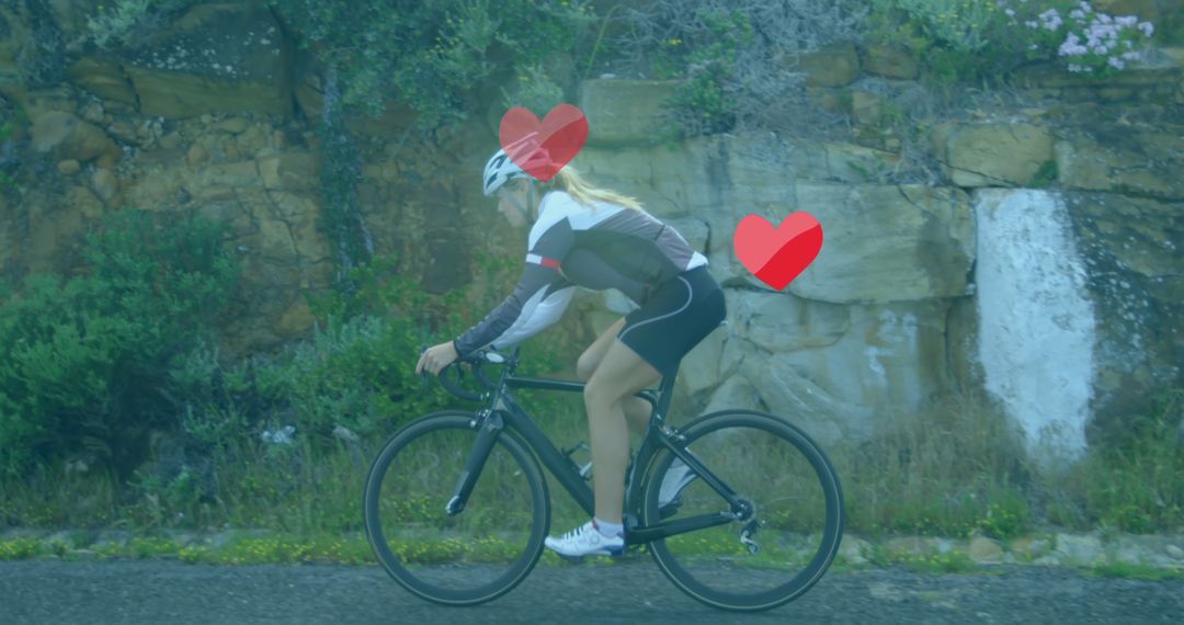 Female Cyclist Riding Bicycle on Country Road Wearing Helmet - Free Images, Stock Photos and Pictures on Pikwizard.com