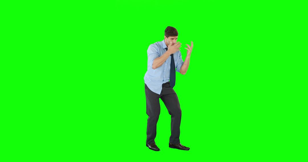 A startled young businessman reacts to something unforeseen on a green screen with space for text. - Free Images, Stock Photos and Pictures on Pikwizard.com