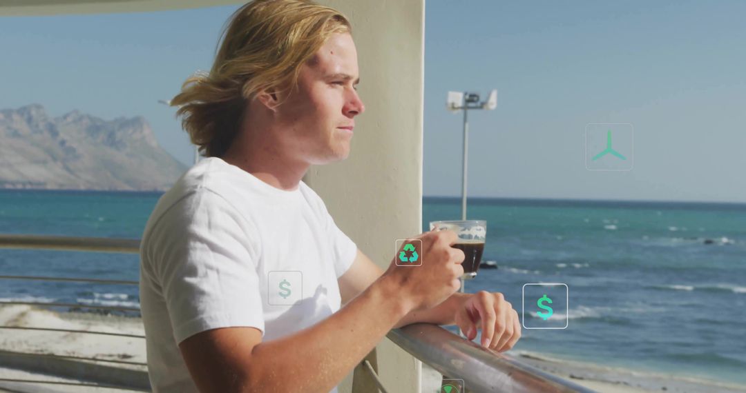 Man Drinking Coffee on Seaside Deck in Relaxed Setting