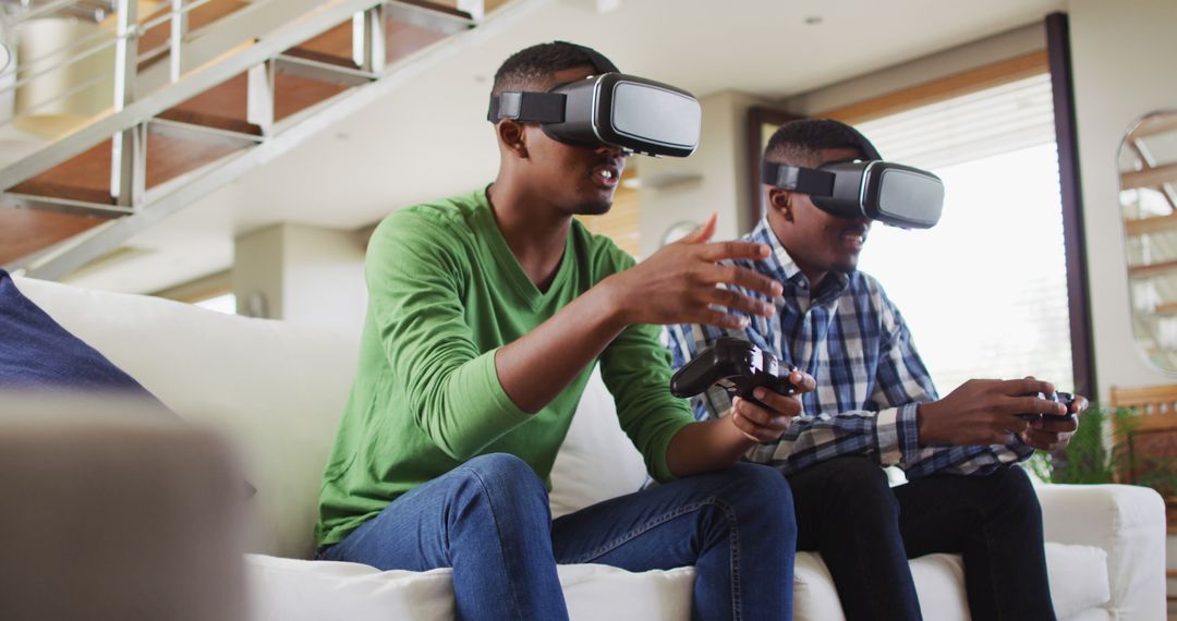 Teenagers Immersed in Virtual Reality Gaming in Modern Living Room - Free Images, Stock Photos and Pictures on Pikwizard.com