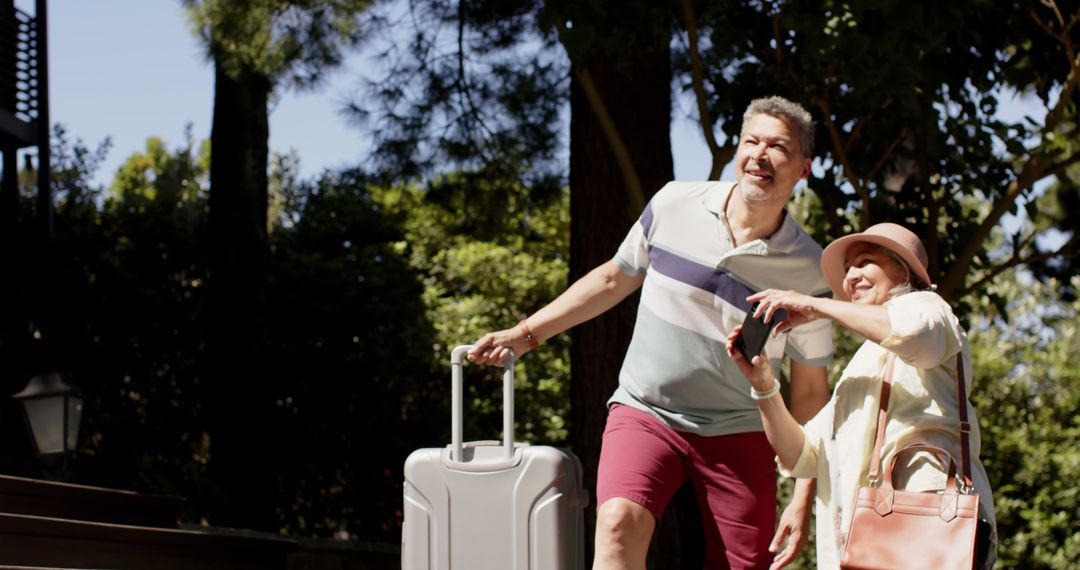 Elderly Couple Arriving at Vacation Destination with Luggage - Free Images, Stock Photos and Pictures on Pikwizard.com