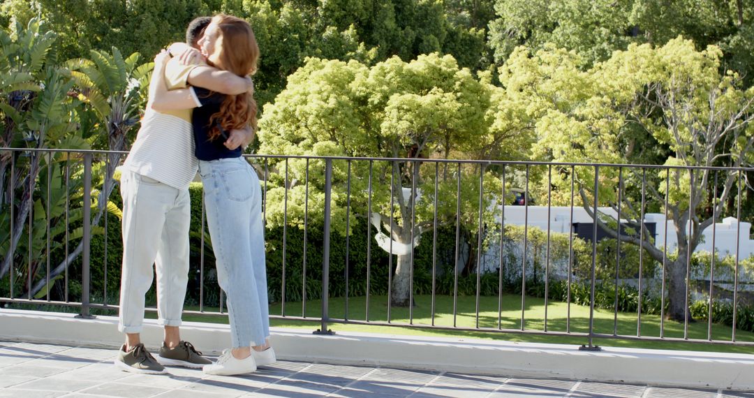 Couple Embracing with Joyful Father Announcing Baby News