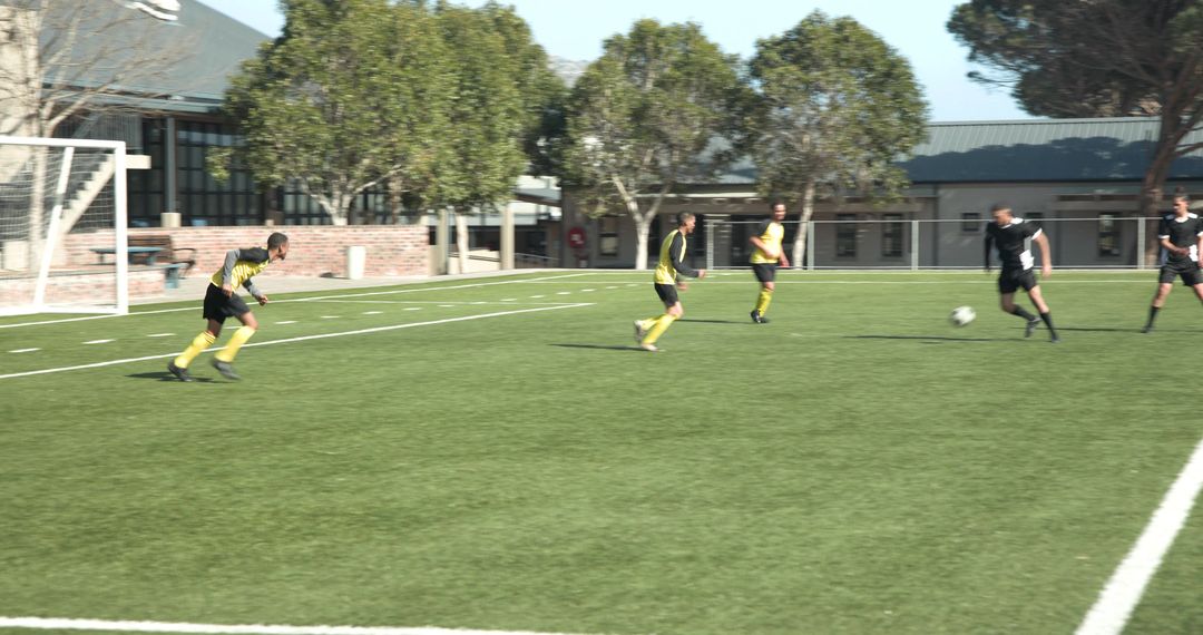Intense Soccer Match Action on School Field Demonstrating Teamwork