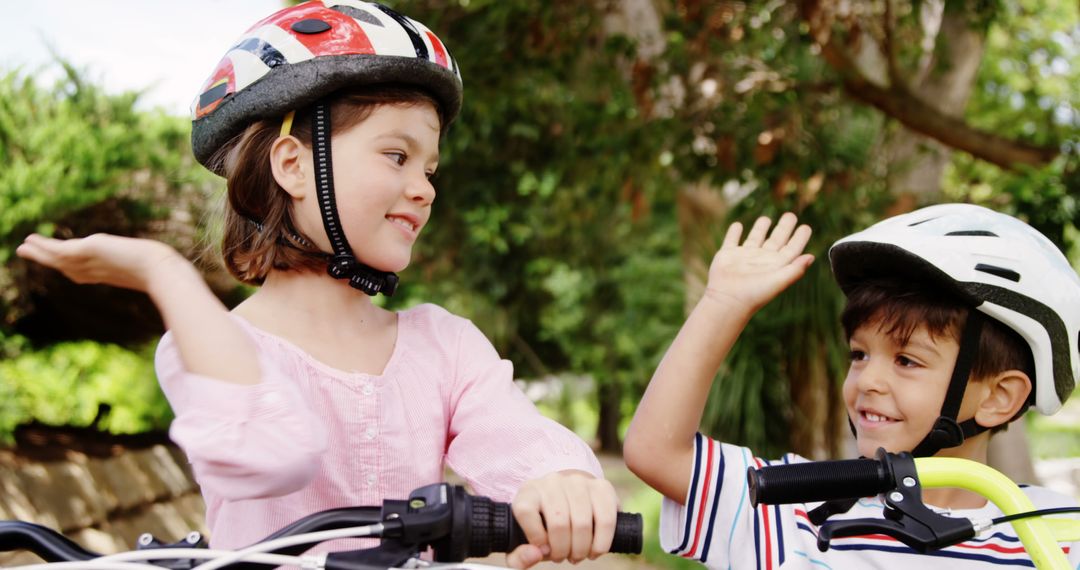 Children Wearing Helmets Riding Bicycles and Smiling - Free Images, Stock Photos and Pictures on Pikwizard.com