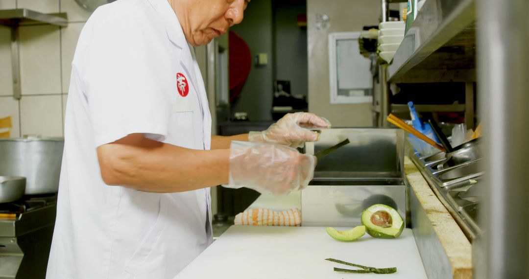 Chef Preparing Fresh Avocados in a Professional Kitchen - Free Images, Stock Photos and Pictures on Pikwizard.com