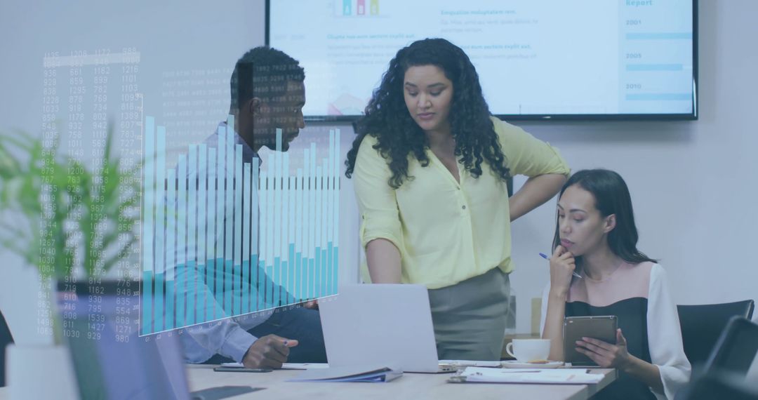 Colleagues Discussing Presentation with Charts in Modern Office