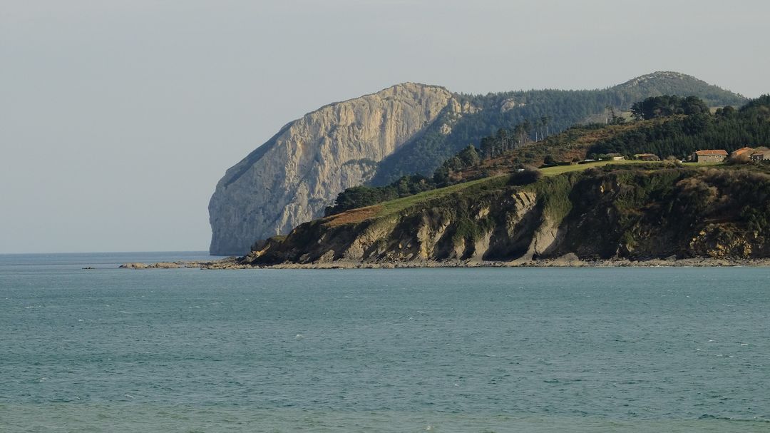 Scenic Coastal Cliff with Green Landscape on a Clear Day - Free Images, Stock Photos and Pictures on Pikwizard.com