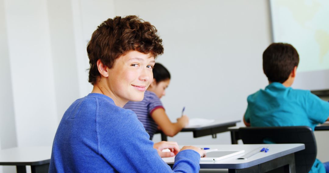 Smiling Teenage Boy Engaged in Classroom Learning Environment