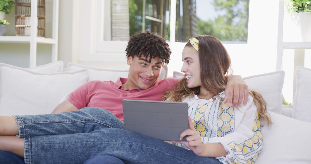 Relaxed Couple Enjoying Technology at Home Lounge Space