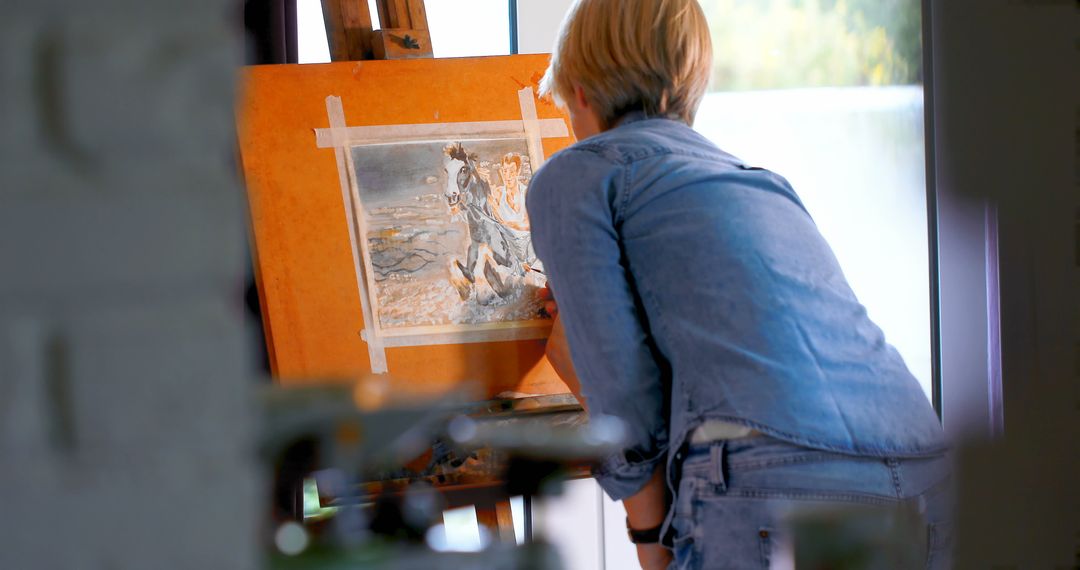 Female Artist Painting on Canvas at Home Workspace