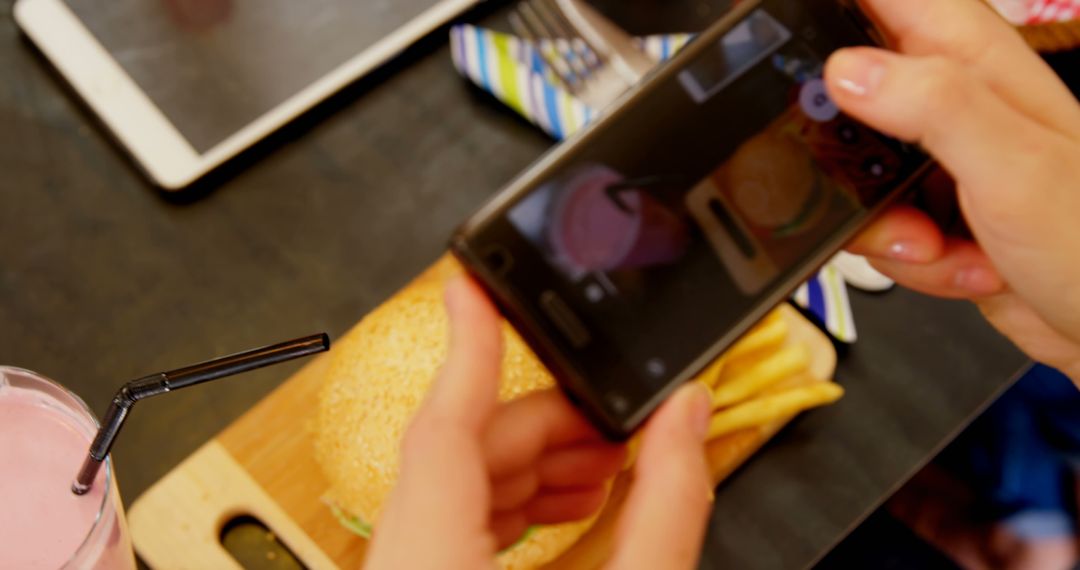 Person Taking Photo of Delicious Burger Meal with Smartphone - Free Images, Stock Photos and Pictures on Pikwizard.com