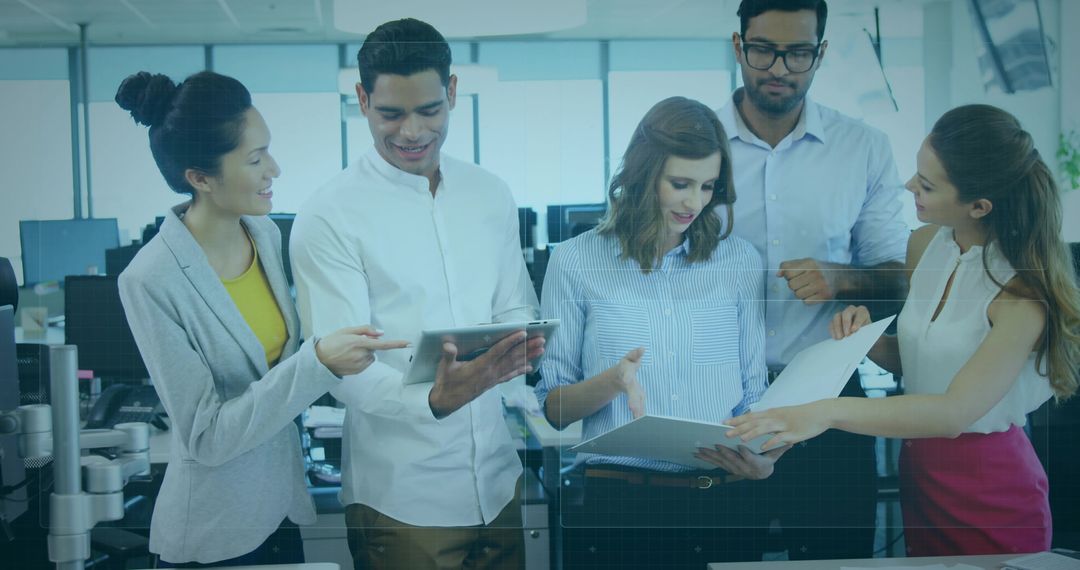 Team Collaborating in Modern Office Using Technology and Reports