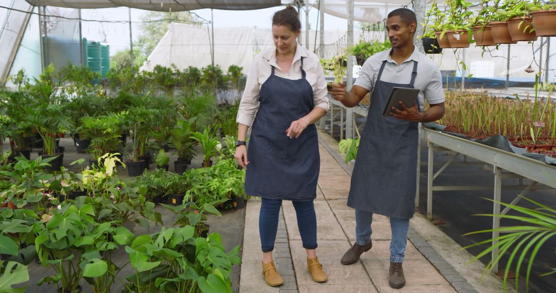 Diverse Team Managing Plant Nursery with Digital Technology