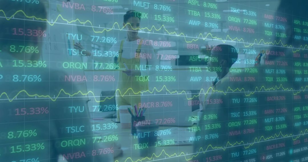 Business team collaborating around laptop with stock ticker overlay for financial strategy