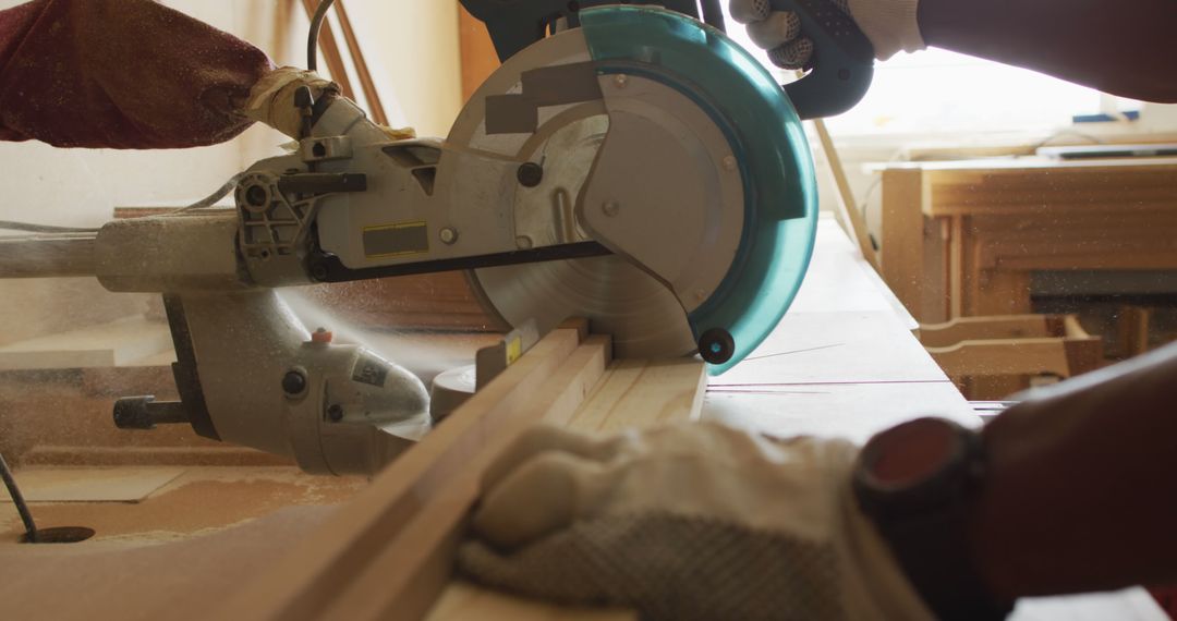 Carpenter Cutting Wooden Plank with Electric Saw - Free Images, Stock Photos and Pictures on Pikwizard.com