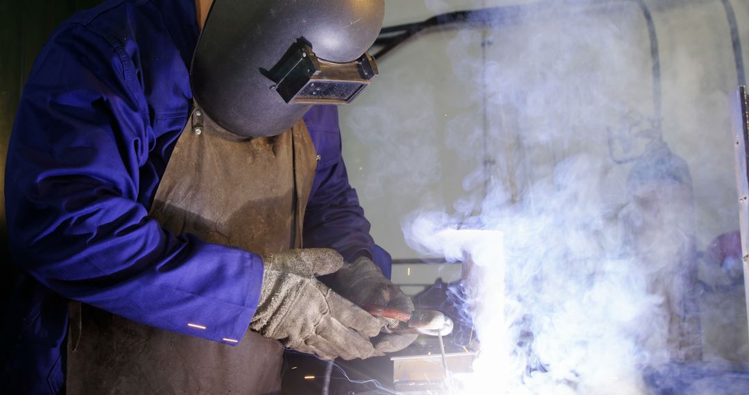 Industrial Welder Working with Steel in Protective Gear - Free Images, Stock Photos and Pictures on Pikwizard.com