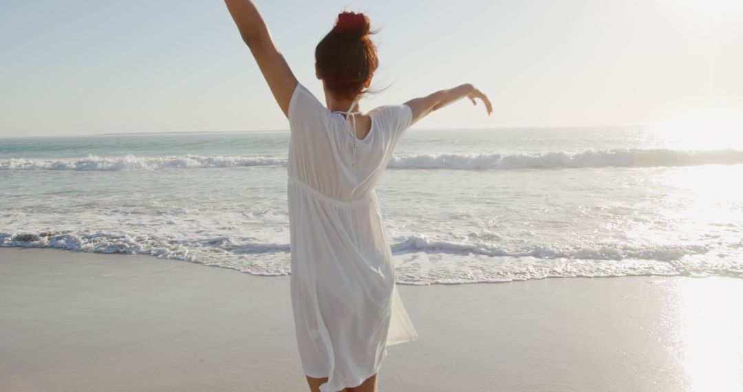 Carefree Woman Enjoying Sunset on Sandy Beach - Free Images, Stock Photos and Pictures on Pikwizard.com